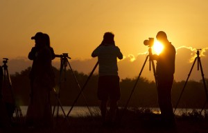 Journalists gather to cover the launch of the space shuttle Endeavour STS-134 as the sun rises at the Kennedy Space Center in Cape Canaveral, Florida